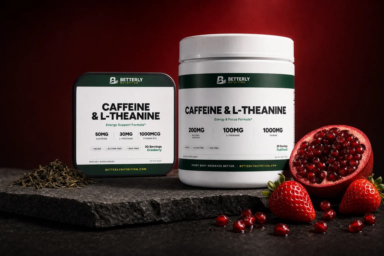 Caffeine & L-Theanine Energy Powder tub and Energy Strips pack on dark stone with halved pomegranate, strawberries and loose green tea
