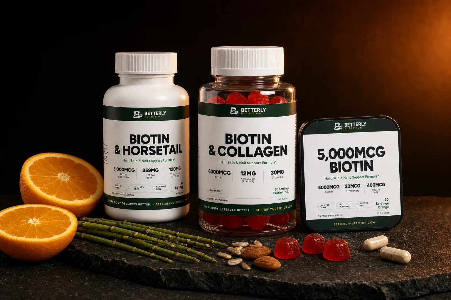 Biotin & Horsetail capsules, Biotin & Collagen gummy jar and 5,000mcg Biotin Strips on dark slate with halved oranges, gummies, almonds