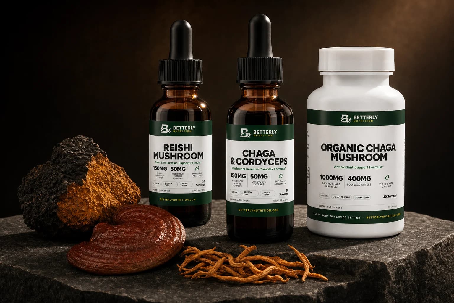 Reishi Mushroom and Chaga & Cordyceps dropper bottles beside Organic Chaga Mushroom capsules on dark stone with reishi, chaga and cordyceps