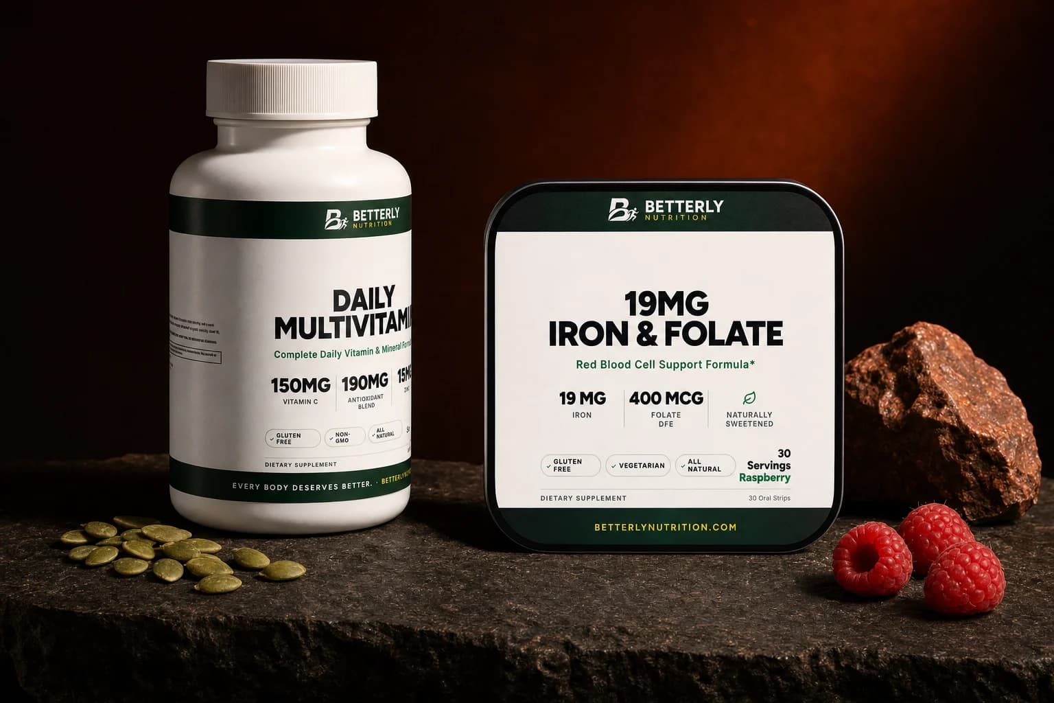 19mg Iron & Folate Strips tin beside a Daily Multivitamin Capsules bottle on dark granite, with pumpkin seeds, raspberries and iron ore