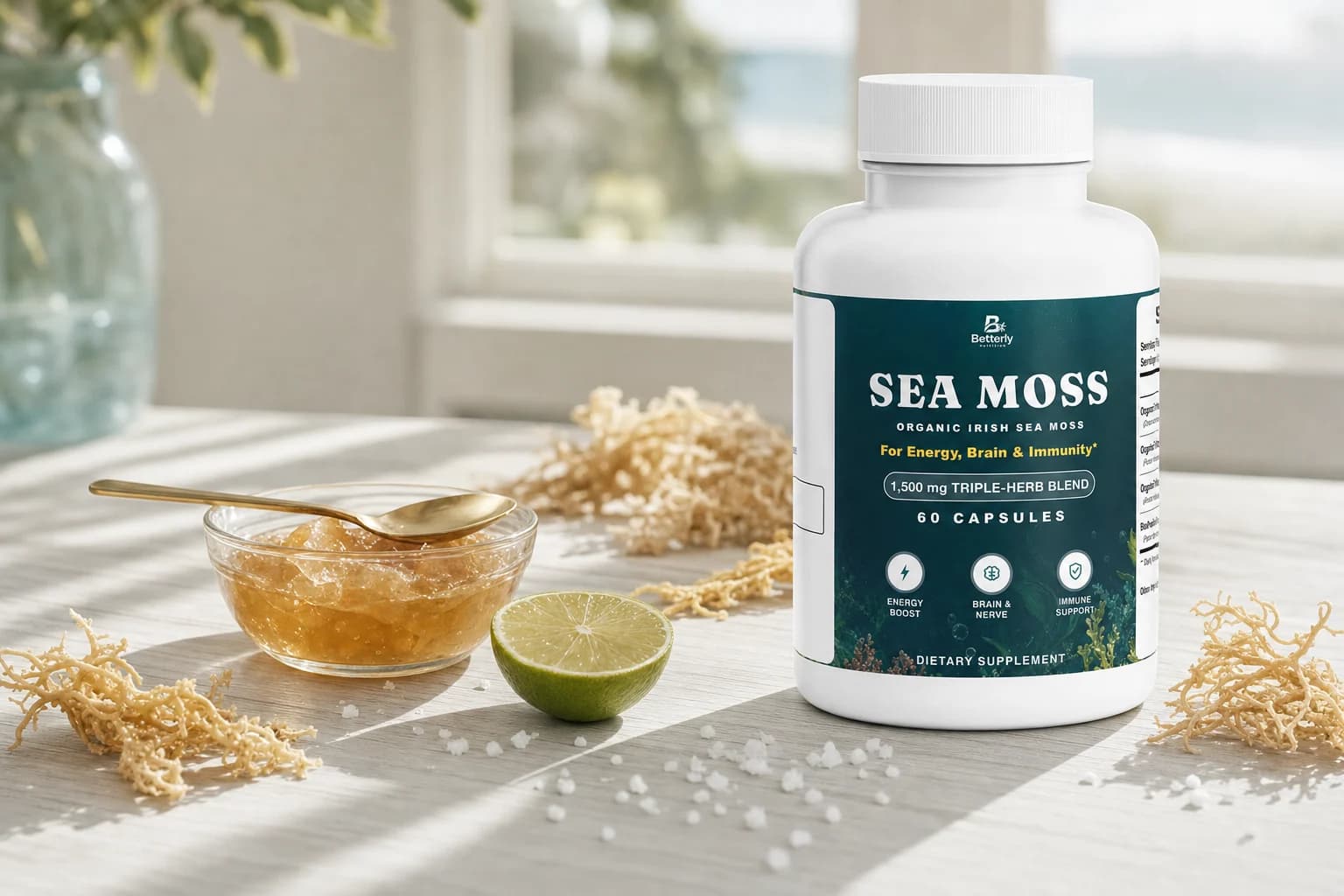 Sea Moss bottle on a pale ash counter with dried strands and golden gel
