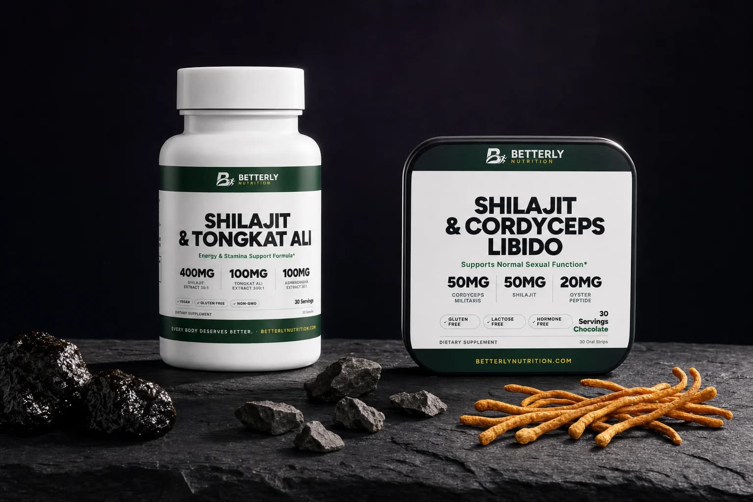 Shilajit & Tongkat Ali bottle and Shilajit & Cordyceps Libido tin on dark slate beside glossy resin lumps, rock chips and orange cordyceps